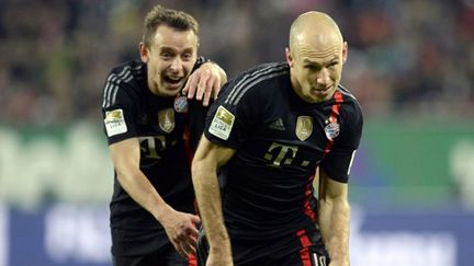 Rafinha et Arjen Robeen (Bayern Munich) (CHRISTOF STACHE / AFP)