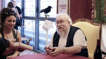 George R.R. Martin, le père de la série planétaire "Game of Thrones" va voir une autre de ses histoires adaptée, "Dragon de Glace", cette fois en un long métrage animé.
 (PHILIPPE MERLE / AFP)