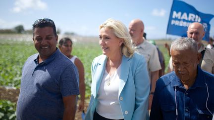 Marine Le Pen lors d'une visite à Saint-François (Guadeloupe), le 27 mars 2022.&nbsp;&nbsp; (CEDRICK ISHAM CALVADOS / AFP)