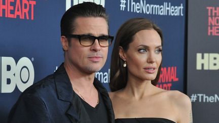 L'acteur Brad Pitt et sa compagne Angelina Jolie &agrave; une avant-premi&egrave;re, &agrave; New York (Etats-Unis), le 12 mai 2014. (BEN GABBE / GETTY IMAGES NORTH AMERICA / AFP)