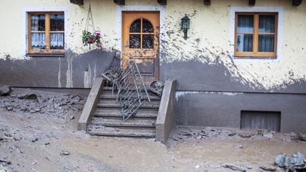 The facade of a house is sprayed with muddy water after a mudflow burst through Hoegmoos, Taxenbach, 100 km south of Salzburg, Austria, 02 June 2013. ( MAXPPP)