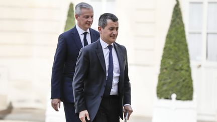 Bruno Lemaire et Gérarld Darmanin arrivent à la conférence de presse d'Emmanuel Macron le jeudi 26 avril 2019.&nbsp; (LAURE BOYER / HANS LUCAS)