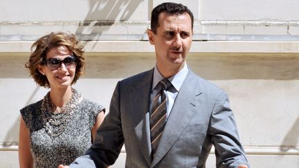 Le président syrien Bachar al-Assad et son épouse Asma arrivent à l'Elysée, à Paris, le 14 juillet 2008. (DOMINIQUE FAGET / AFP)