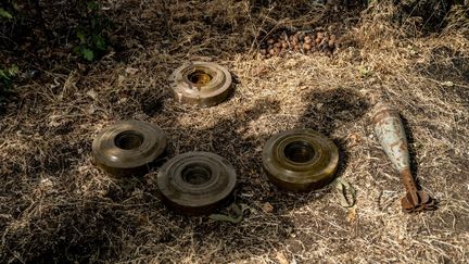 Mines and a shell before their detonation by Ukrainian soldiers, in Donetsk Oblast, Ukraine, on June 15, 2024. (JOSE COLON / ANADOLU / AFP)