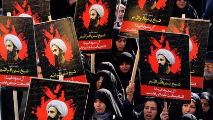 Manifestation d'Iraniennes place de l'Imam Hossein à Téhéran, le 4 janvier 2016, pour dénoncer l'exécution de l'opposant chiite, cheikh Nimr Baqer al-Nimr par les autorités saoudiennes. (AFP PHOTO / ATTA KENARE)