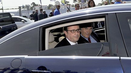 Le pr&eacute;sident de la R&eacute;publique, Fran&ccedil;ois Hollande, arrive aux 24 Heures du Mans, le 13 juin 2015. (GUILLAUME SOUVANT / AFP)