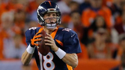 Peyton Manning (Denver Broncos) est le nouveau recordman des TD lancés en une saison (510) (DOUG PENSINGER / GETTY IMAGES NORTH AMERICA)