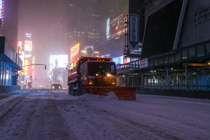 A snowplow passes through Manhattan's iconic Times Square in New York on January 29, 2022.   (TAYFUN COSKUN / ANADOLU AGENCY / AFP)