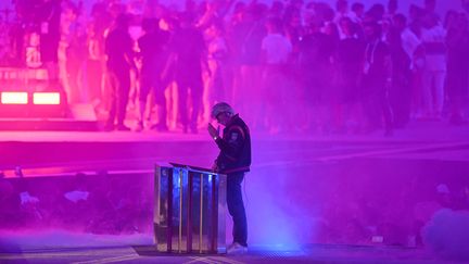 DJ Kavinsky performs his hit "Nightcall" during the closing ceremony of the Paris 2024 Olympic Games on August 11. (JUNG YEON-JE / AFP)