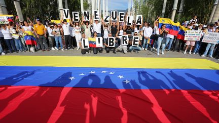 Venezuelans living in Colombia take part in a protest against Venezuelan President Nicolas Maduro's disputed victory in Venezuela's presidential elections during a rally in Medellin, Colombia, on August 3, 2024. (JAIME SALDARRIAGA / AFP)