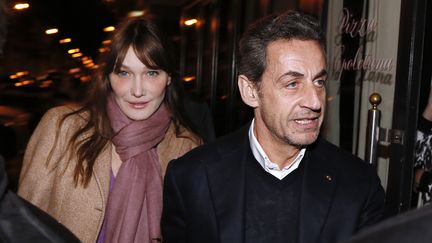 L'ancien pr&eacute;sident de la R&eacute;publique Nicolas Sarkozy et sa femme Carla Bruni, le 28 janvier 2013 &agrave; Paris. (KENZO TRIBOUILLARD / AFP)