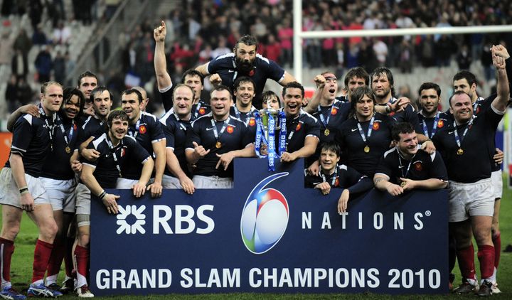 Trinh-Duc, on the left of the trophy, and the French team celebrate their victory in the Six Nations Tournament, March 20, 2010. (FRANCK FIFE / AFP)