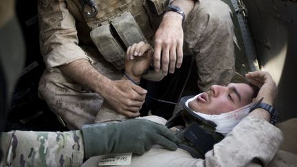 Joseph Sandoval souffre d’une commotion cérébrale. Son véhicule a percuté un engin explosif improvisé. (AFP PHOTO / BEHROUZ MEHR)