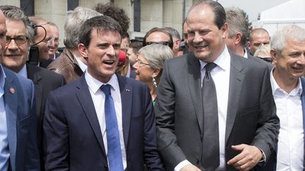  (Manuel Valls et Jean-Christophe Cambadelis, ici à Poitiers, répliquent à la critique lancée par Arnaud Montebourg © MaxPPP)