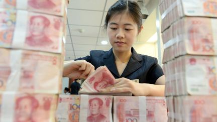 La Banque centrale chinoise a abaissé ses taux d'intérêts par six fois depuis fin 2014 pour faire baisser le Yuan. (AFP/ Li xIANGYU/ IMAGINE CHINA)