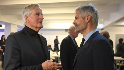 Michel Barnier et Laurent Wauquiez, le 24 janvier 2023, à Paris. (EMMANUEL DUNAND / AFP)