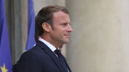 Emmanuel Macron a durci le ton sur la question migratoire, à 15 jours d'un débat sur l'immigration au Parlement.&nbsp; (LUDOVIC MARIN / AFP)