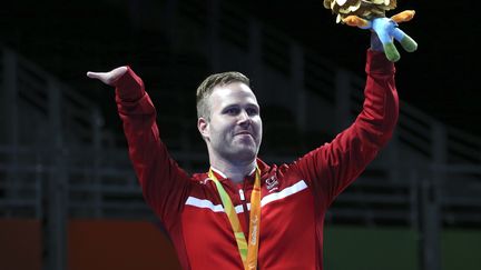 Encore un beau sourire, celui du Danois&nbsp;Peter Rosenmeier, médaille d'or de tennis de table aux jeux de Rio. (SERGIO MORAES / REUTERS)