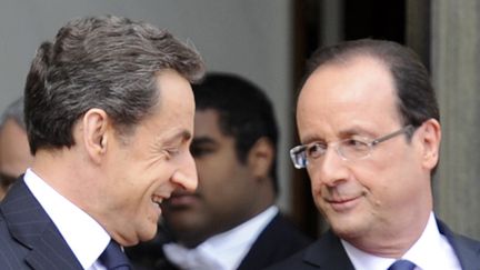 Nicolas Sarkozy et Fran&ccedil;ois Hollande lors de la passation de pouvoirs, le 15 mai au palais de l'Elys&eacute;e. (BERTRAND GUAY / AFP)