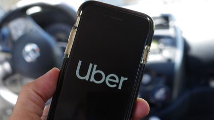 Illustration de l'application Uber, le 11 juillet 2022. (MATHIEU THOMASSET / HANS LUCAS / AFP)