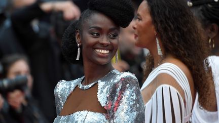 Pour lutter contre la sous-représentation, voire "l'invisibilité", des personnes noires au cinéma, les quotas pourraient être "une des voies possibles", selon la comédienne française d'origine sénégalaise Aïssa Maïga, à l'initiative de cette marche. "On ne souhaite pas faire d'effet d'annonce, que ce mouvement soit un soufflé, qu'il retombe après avoir fait beaucoup de bruit. Ce qui nous intéresse, c'est d'instaurer le dialogue avec les gens qui font le cinéma, depuis le scénariste au financier en passant par le producteur, le réalisateur, le directeur de casting."
 (LOIC VENANCE / AFP)