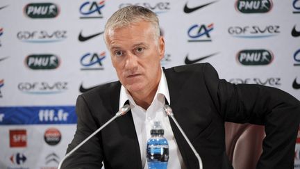 Antoine Kombouaré (PSG) et Didier Deschamps (OM) détendus avant le clasico (BERTRAND GUAY / AFP)