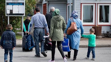 Des réfugiés syriens arrivent en Allemagne, dans un foyer de Goettingen (Swen Pfoertner / dpa / AFP)