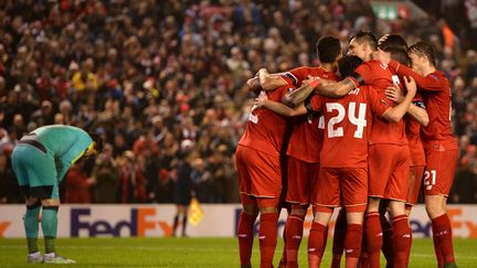 Les Reds célèbrent leur victoire. (OLI SCARFF / AFP)