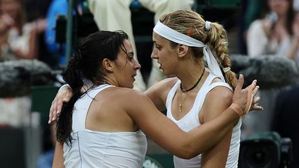 Bartoli et Lisicki en 2011. En quarts de finale, l'Allemande s'était imposée6-4, 6-7 (4/7), 6-1. (CARL DE SOUZA / AFP)