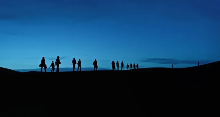 The march of migrants in the desert, image from the film 