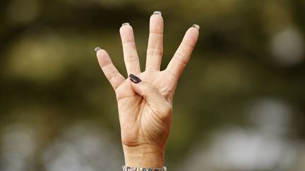 Une supportrice du pr&eacute;sident am&eacute;ricain Barack Obama r&eacute;clame "4 ann&eacute;es suppl&eacute;mentaires" pendant un discours du candidat &agrave; l'&eacute;lection pr&eacute;sidentielle &agrave; Tampa (Floride), le 25 octobre 2012. (KEVIN LAMARQUE / REUTERS)