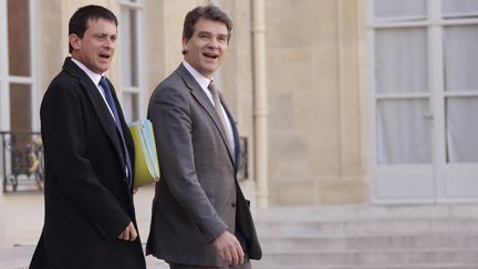 Le ministre de l'Int&eacute;rieur, Manuel Valls, et le ministre du Redressement productif, Arnaud Montebourg, le 31 octobre 2012 &agrave; l'Elys&eacute;e (Paris). (PHILIPPE WOJAZER / REUTERS)