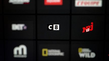 Les chaînes C8 et NRJ12 ont été écartées de la grille de la télévision numérique terrestre (TNT) le 24 juillet 2024. (SERGE TENANI / HANS LUCAS / AFP)