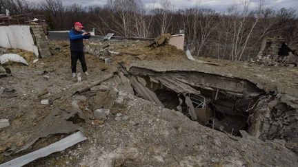 A building hit by a Russian missile in Kharkiv, Ukraine, March 26, 2024. (YEVHEN TITOV / ANADOLU / AFP)