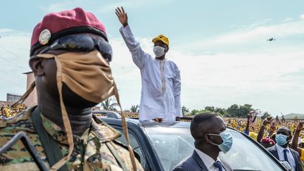 Le président guinéen Alpha Condé (au centre), lors d'un meeting de campagne organisé à Conakry, le 16 octobre 2020. (EDDY PETERS / XINHUA / AFP)