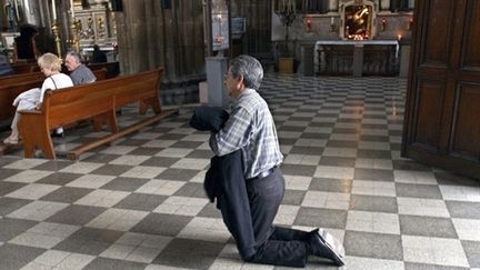 Cette application est la première application approuvée par les autorités catholiques. (AFP PHOTO/Alfredo ESTRELLA)