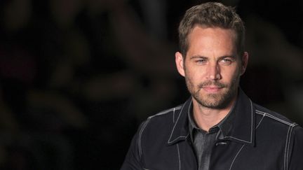 L'acteur am&eacute;ricain Paul Walker, le 21 mars 2013, lors d'un d&eacute;fil&eacute; &agrave; la fashion week de Sao Paulo (Br&eacute;sil). (FILIPE CARVALHO / REUTERS)