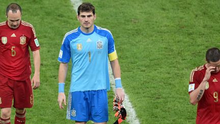 Andres Iniesta, Iker Casillas et Fernando Torres après la défaite contre le Chili au Mondial 2014