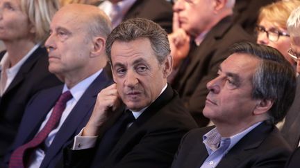 Alain Juppé, Nicolas Sarkozy et François Fillon, lors d'un meeting des Républicains à Nogent-sur-Marne (Val-de-Marne), le 27 septembre 2015. (MAXPPP)