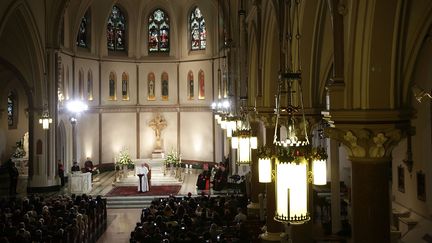 Le Pape François en visite aux Etats-Unis, le 24 septembre 2015, dans l'église St Patrick à Washington. (ALEX WONG / GETTY IMAGES NORTH AMERICA / AFP)