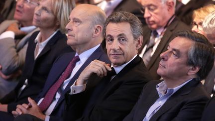 Alain Juppé, Nicolas Sarkozy et François Fillon assistent à un meeting des Républicains pour les élections régionales, à Nogent-sur-Marne, le 27 septembre 2015. (MAXPPP)