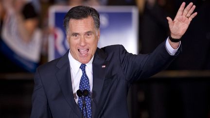 Le candidat &agrave; l'investiture r&eacute;publicaine Mitt Romney c&eacute;l&egrave;bre sa victoire dans l'Illinois face &agrave; ses partisans, &agrave; Schaumburg, le 20 mars 2012. (DON EMMERT / AFP)