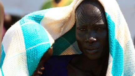 Une Sud-Soudanaise et son bébé ont trouvé refuge dans le camp de Bidi Bidi en Ouganda, le 7 décembre 2016. Près d'un million de Sud-Soudanais ont traversé la frontière de l'Ouganda pour échapper aux violences. (Photo Reuters/James Akena)