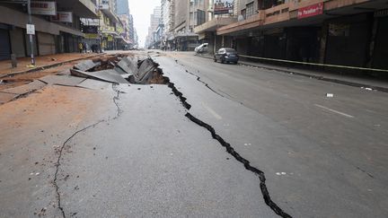 The pavement is split, the day after the explosion in a street in Johannesburg (South Africa), July 19, 2023. (LUCA SOLA / AFP)