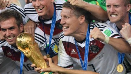 Les joueurs allemands f&ecirc;tent leur titre de champion du monde, le 13 juillet 2014 &agrave; Rio de Janeiro (Br&eacute;sil). (ALEXANDER VILF / RIA NOVOSTI / AFP)