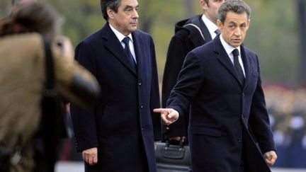 Nicolas Sarkozy et François Fillon (11 novembre 2011) (AFP/Lionel Bonaventure)