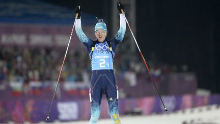 Les quatre biathlètes russes du relais victorieux (de gauche à droite) : Dmitry Malyshko, Anton Shipulin, Alexei Volkov, et Yevgeny Garanichev. (PIERRE-PHILIPPE MARCOU / AFP)