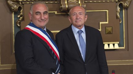 Georges Kepenekian et Gérard Collomb, le 17 juillet 2017, à Lyon.&nbsp; (ROMAIN LAFABREGUE / AFP)