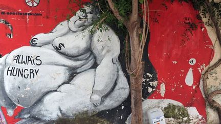 &quot;Toujours affamé&quot; : Street Art à Athènes contre la crise
 (LOUISA GOULIAMAKI/AFP)