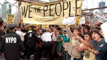 Les indignés de Wall Sreet, samedi dernier, sur le pont de Brooklyn.